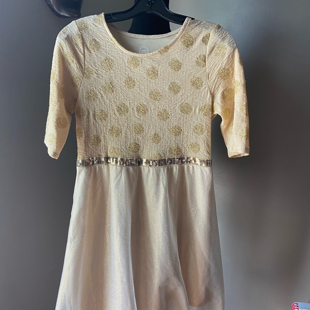 This is Tan and sequence Wonder nation dress